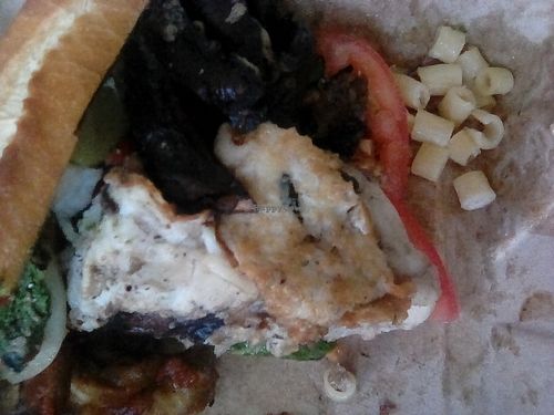 Chili Garlic & Balsamic Marinated Portabella Mushrooms Served on a Soft Hoagie Roll with Pesto, Melted Mozz & Feta Cheese, Grilled Peppers, onions at The Butcher's Son in Berkeley