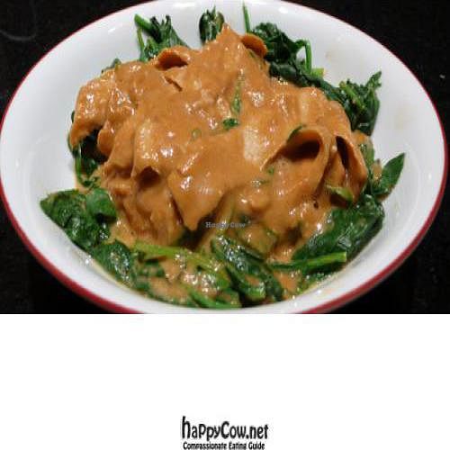 praram's plate: marinated soy chicken pan-fried with peanut sauce on a bed of steamed spinach - photo by MR MEANER at Vegan Plate in Studio City