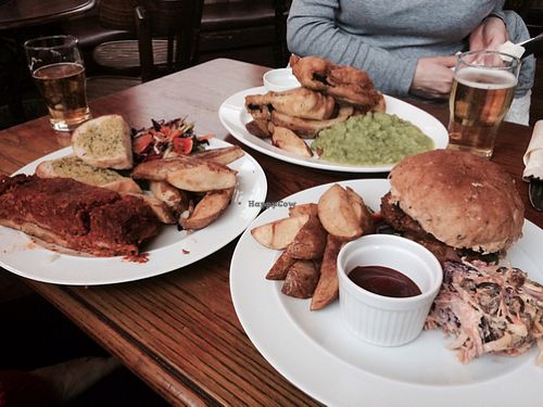 Fish and chips (back), the lasagna (left) and seitan burger (right) - all absolutely beautiful meals! So impressed with the food ❤ at The Peacock in Nottingham