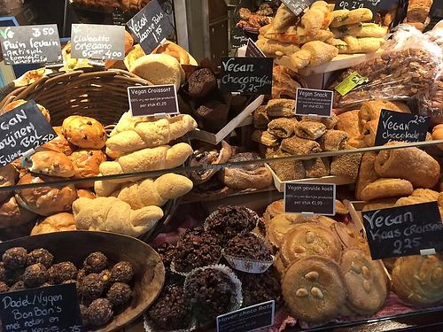 Vegan bakery display with croissants, pain chocolat, gevulde koek (almond stuffed cookies), raisin buns, chocolate bites and sausage rolls. at Het Zaanse Bakkertje / Dutch Vegan Bakery in Zaandijk