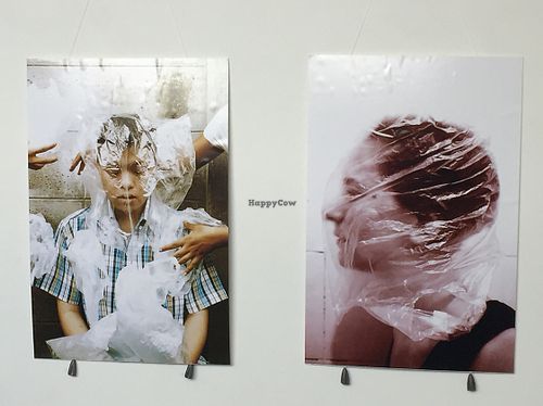 Very unsettling images in the cafe :(. I think they should remove them >_ at Food4Thought in Chiang Mai