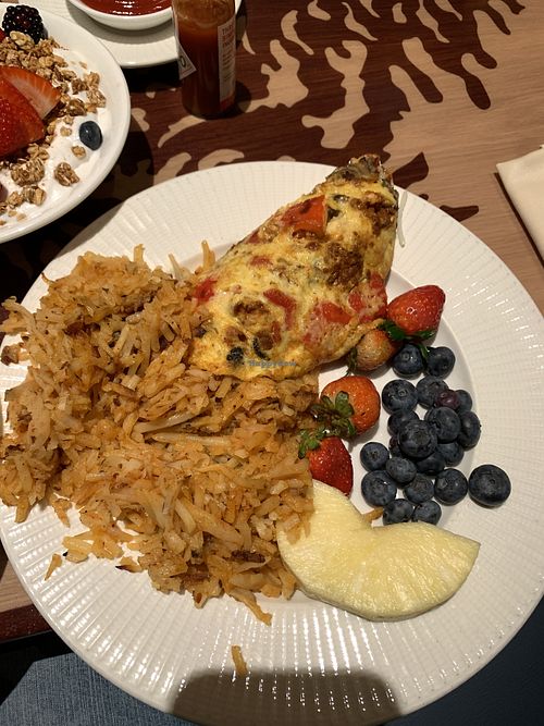 Hash browns, vegan omelette, and fresh fruit   at Disneyland - Storytellers Cafe in Anaheim