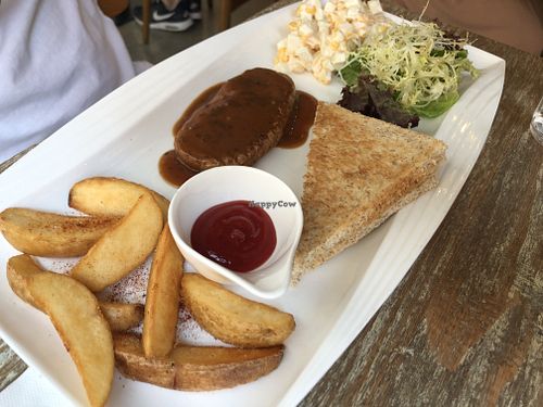 Pan-fried vegan steak with black pepper sauce set with toast, salad and wedges  at LN Fortunate Coffee in Hong Kong Island