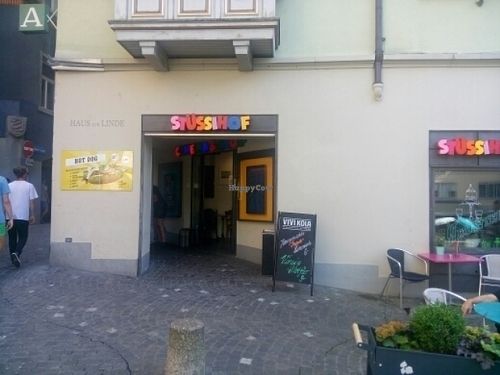 Entrance plus tables outside at Kino Stuessihof in Zurich