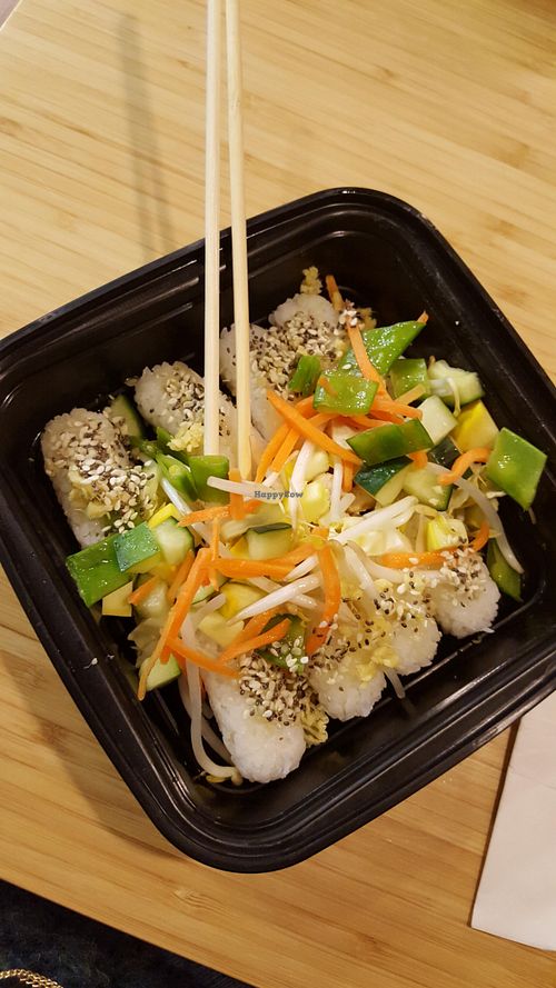 These veggie Riceballs were delicious! Topped with ginger lemongrass sauce and heaped with fresh veggies! at Quarks American Bento in St Cloud