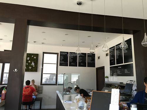 Wall menu by counter where goi cuon are made at Magasin in New Orleans