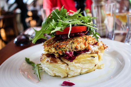Gluten-free burger with potatoes gratin at Vegan's Prague in Prague