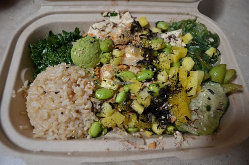 Tofu poke bowl with brown rice, kale, seaweed salad, edamame, cucumbers, seaweed, pineapple, mango. at Pokeatery in San Mateo