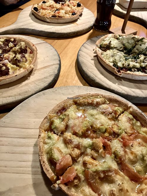 Burger pizza (left), mischief (top), damned (right), brimstone (bottom)  at Hell Pizza in Queenstown