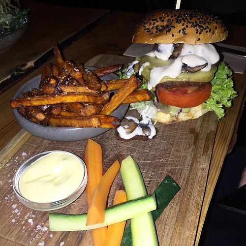 Burger and fries with dip and vegetables. Bread a little dry but the rest was very good! at Souls in Copenhagen