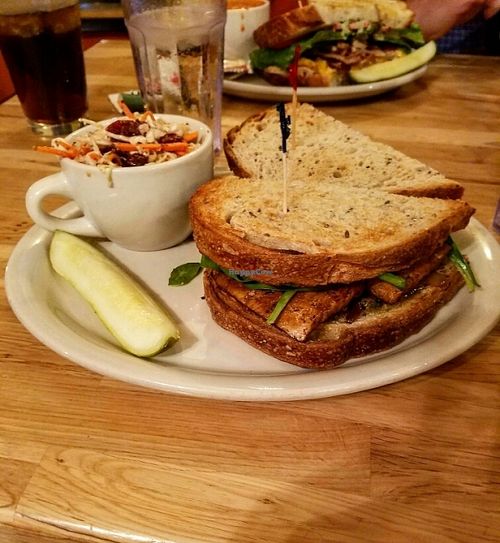 The Mast sandwich (vegan): marinated tofu, vegan walnuts basil pesto, spinach, and garlic veganaise on fresh rye bread (served with vegan coleslaw) at Crow's Nest in Kalamazoo