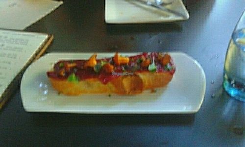 pan de coca con los pimientos de piquillo y setas  at El Maderal in Barcelona