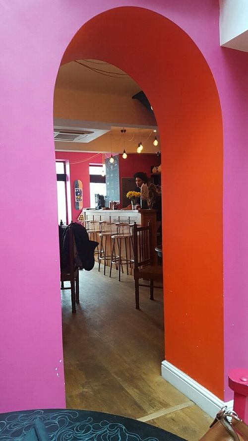 arch between glassed eating area and main room at Voltaire in Bangor