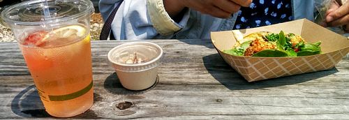 Falacos picnic lunch; strawberry/lemon infused water, nutty chocolate ball, Italian-style falafel taco at Falacos - Food Truck in Houston