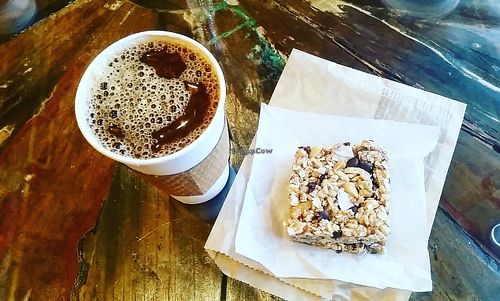 Coffee with almond milk and one of their delicious vegan bars!  at Coffee Plant Roaster in Eugene