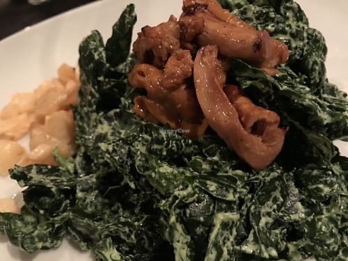 Massaged kale salad with parsnip chips, garbanzo croutons and chanterelle mushrooms at Harvest Beat in Seattle