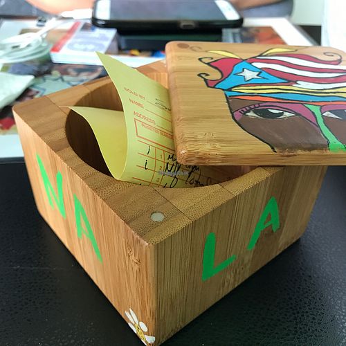 Cool little box that the check comes in at La Morena Bar and Restaurant in Lares