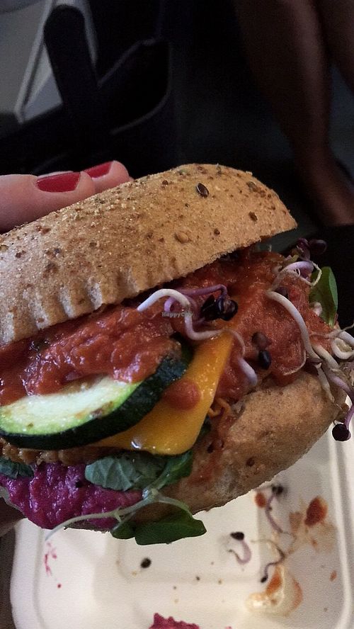 Sweet potato burger with beetroot horseradish creme, sprouts, zucchini, vegan cheddar and and and   at Vegan Love in Budapest