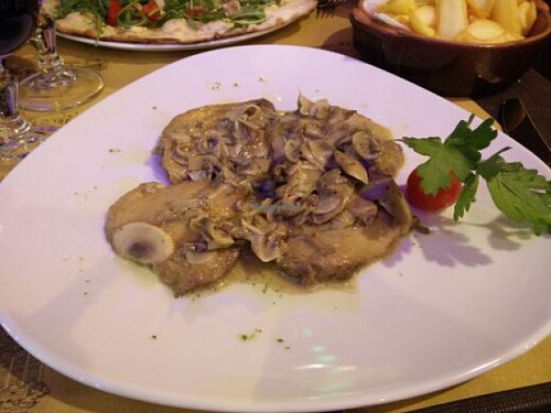 Seitan steaks in mushroom sauce at Rifugio Romano in Rome