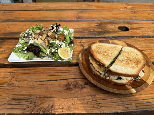 Pesto sandwich with a Caesars salad side. Super delish!  at Cafe Wylde in Everett
