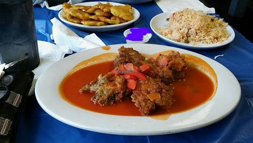 Eggplant balls (so good!) with pigeon peas and fried plantains! at Sabores Dominican Restaurant  in Bossier City