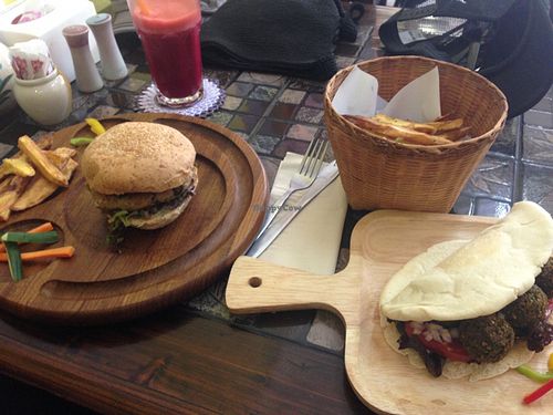 mixed mushroom burger, Thai falafel wrap with hand cut fries and a fresh juice at Karma Kitchen in Chiang Mai