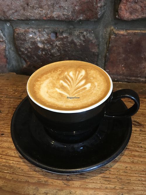 Flat white with oat milk  at Riverhill Coffee Bar in Glasgow