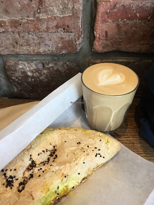 Squash korma pastie and an oat milk latte at Riverhill Coffee Bar in Glasgow