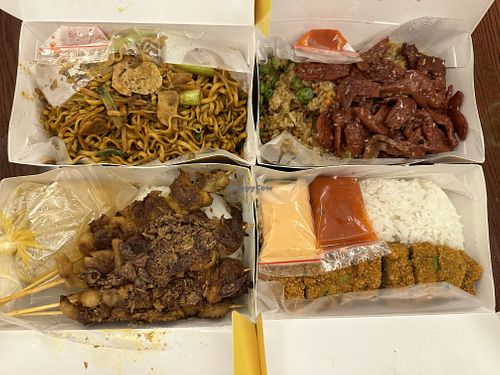 Vegan delivery- noodle dish, cutlet, kebab, and fried rice with vegan meat.  at Loving Hut in Tanjung Duren