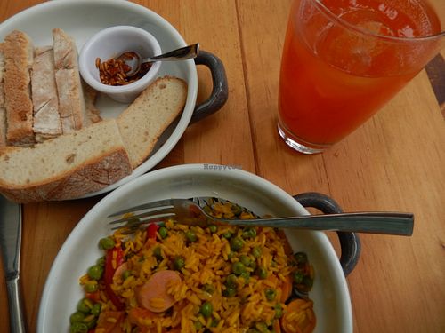 paella with water-of-the-day and complimentary bread with topping at ELK Bistro Deli & Bakery in Mexico City