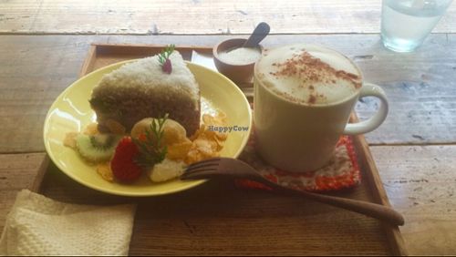 soymilk chai latte and carrot cake w/ coconut cream + assorted fruits. at k u p u in Shunan