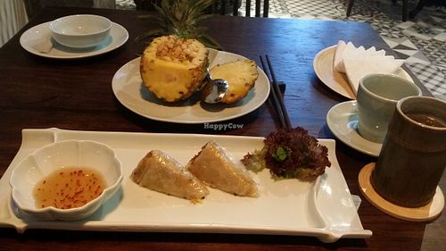 Macadamia & pineapple fried rice and vegetable spring rolls. at Uu Dam Chay in Hanoi