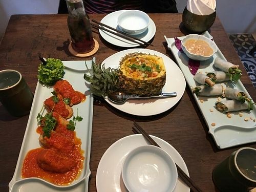 Mushroom stuffed tofu in tomato sauce, macadamia fried rice and fresh mushroom spring rolls  at Uu Dam Chay in Hanoi