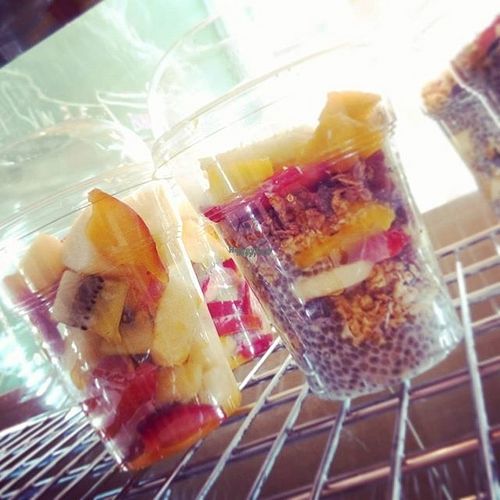 Fresh fruit summer salad and vegan chia pudding made with coconut milk. at Juicitto in Nea Smirni