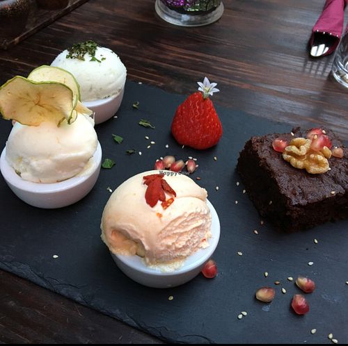 gluten free vegan peanut and walnut brownie with a selection of vegan ice teams  at Amala Conscious Food in Bournemouth