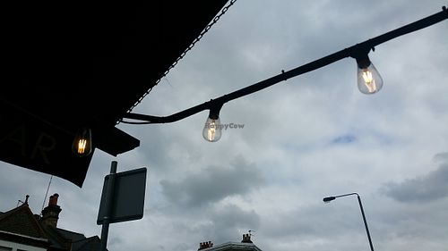 Lightbulbs outside...  at Ground Coffee Society in South West London