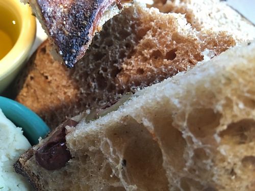 Toast sampler with rosemary white bean spread, chocolate hazelnut spread and olive oil at Tabor Bread in Portland