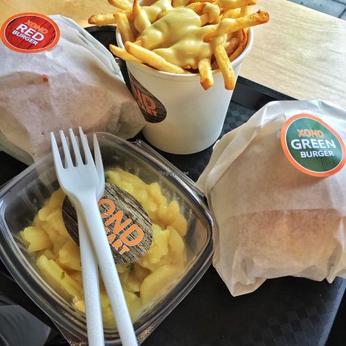 Burgers, potatoes with garlic mayo and potatoe salad at XOND in Stuttgart