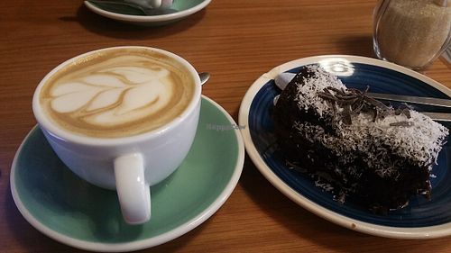 Vegan cappuccino and cake at Pum Pum Cafe in Madrid
