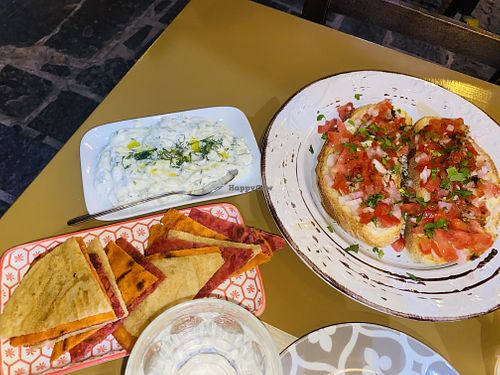 Rhodian pita bread, a vegan tzatziki dip, and bruschetta at ONO in Rhodes