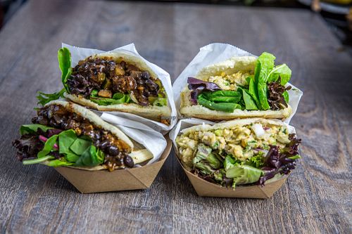 Arepas! Two options to choose from: black beans, zucchini & plantains or seasoned chickpea & artichoke at Soul Cocina in Durham
