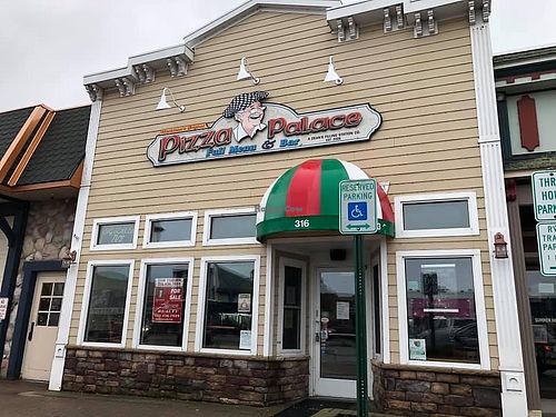 Closed. For sale sign in window.  at Pizza Palace in Mackinaw City
