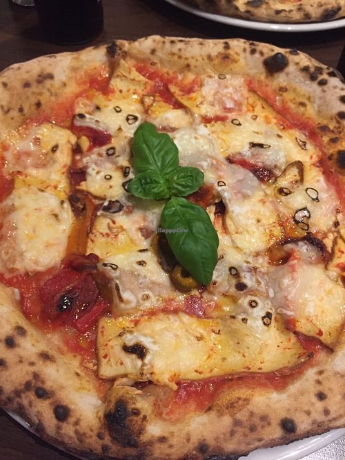 Pizza with vegan cheese, red peppers, smoked tofu, basil at La Stella Nera in Berlin