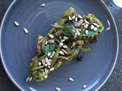 Toast with a green spread and sautéed vegetable at Joe's Place in Pico