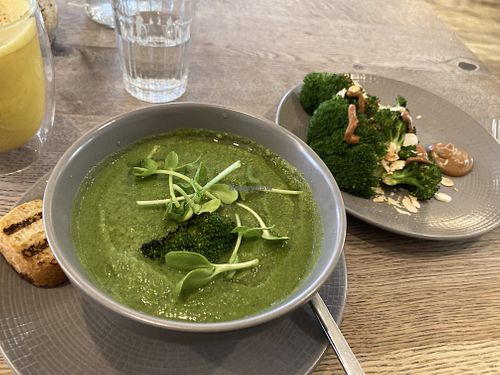 Green soup with side of charred broccoli   at Farmacy in West London
