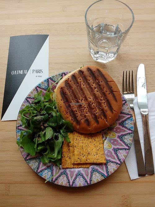The burger at Oatmeal (they call it "sandwich", tho) comes with some delicious salad, and some sort of chips. The burger is very delicious, comes with vegan cheese and tomatoes. Very yummy. at Oatmeal in Paris