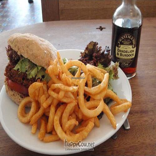 Burger and curly fries, with dandelion and burdock root drink. at Cafe Kino in Bristol