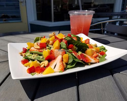 Salad with spinach, strawberries, peaches, quinoa, bell peppers, green onions and cashews at Cafe Uovo in Camp Hill