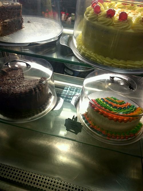 plenty of colourful cakes at Super Natural Newcastle in Newcastle Upon Tyne