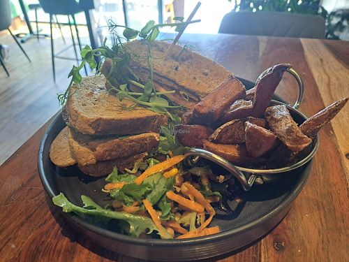 Vegan 'Chikn' sandwich with chips and salad. at Super Natural Newcastle in Newcastle Upon Tyne